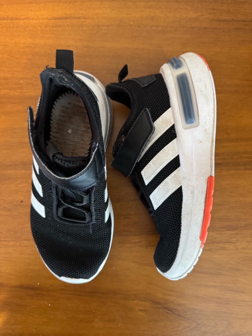 Kids Adidas Black Athletic Sneakers with White Stripes and Orange Accent 13k